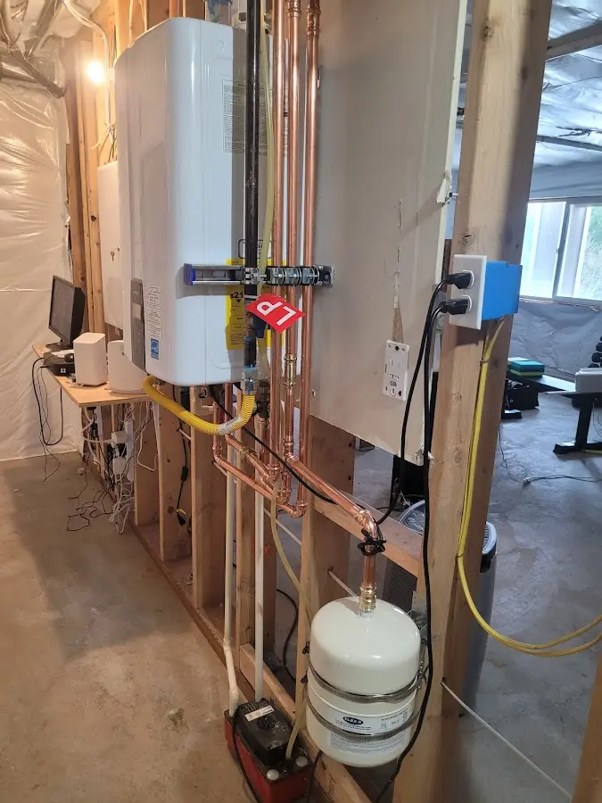 Licensed plumber repairing a kitchen sink in Harmony